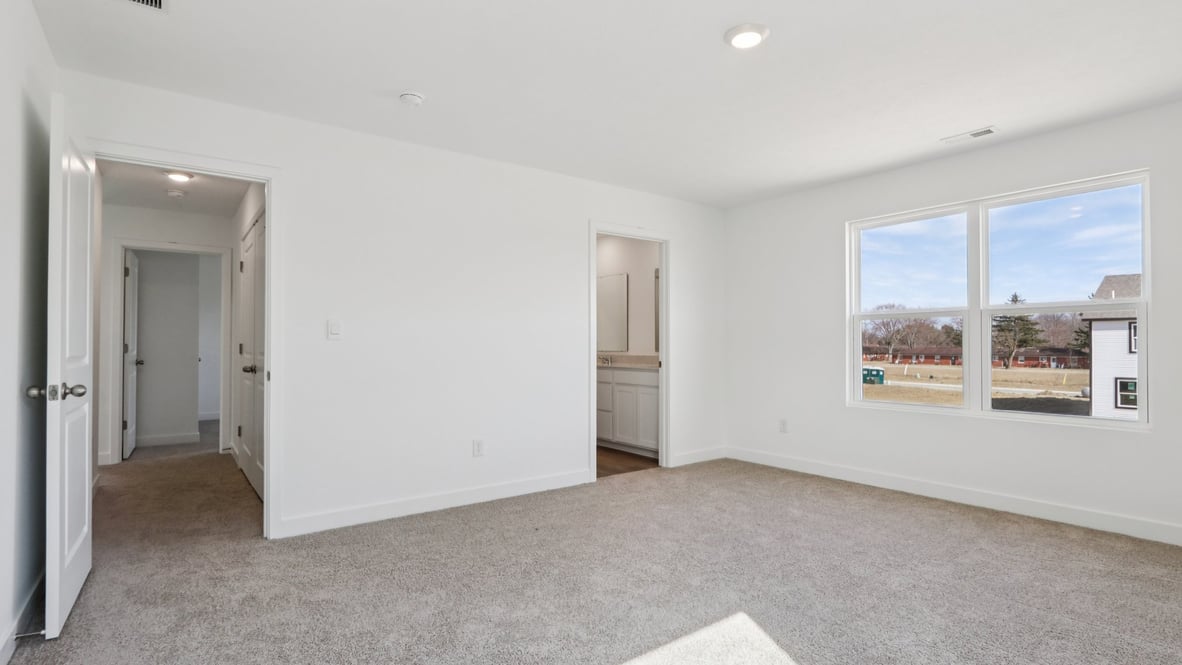 primary bedroom with large windows