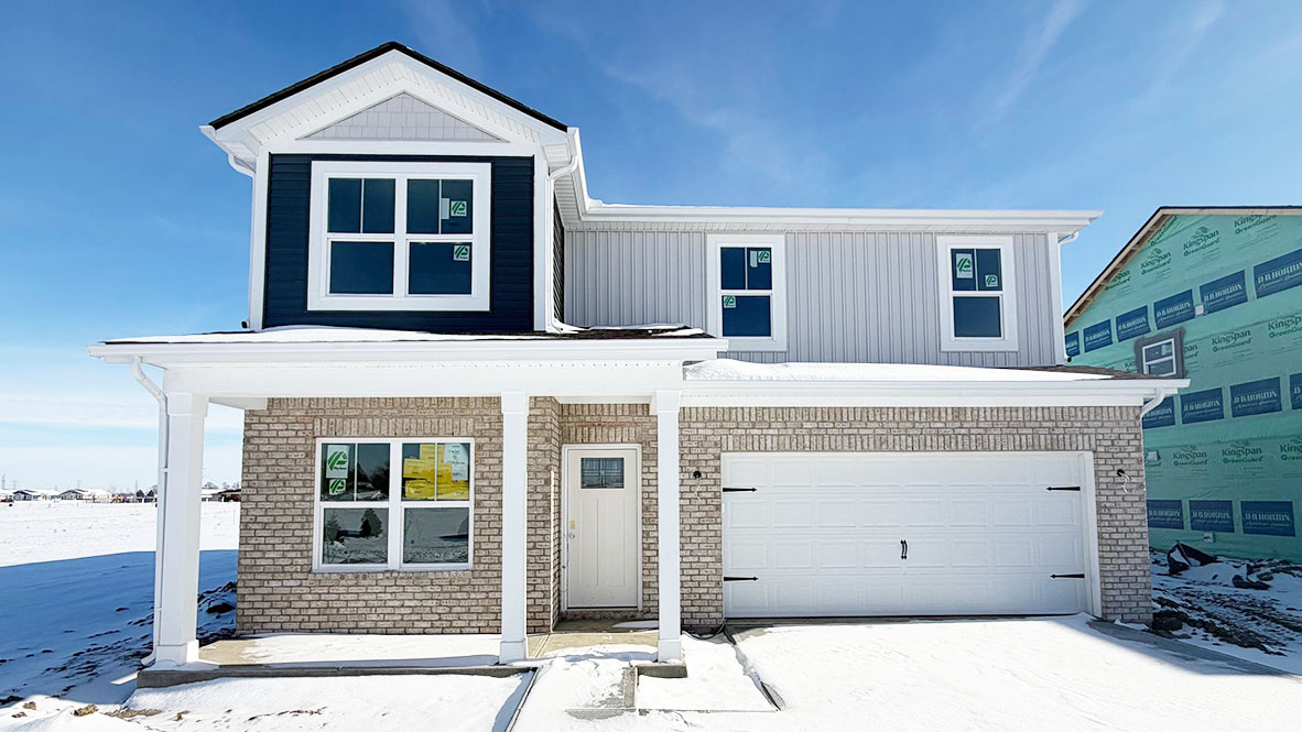 The stamford two story home in Parkview Village with white brick and gray siding