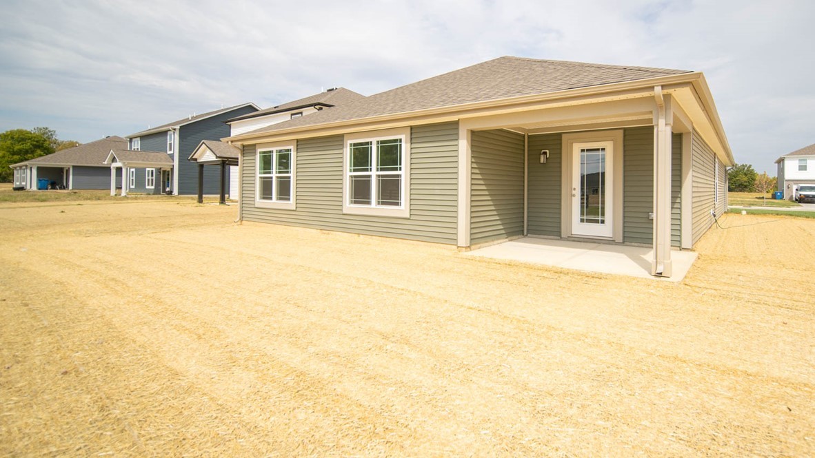 back exterior of home with covered porch