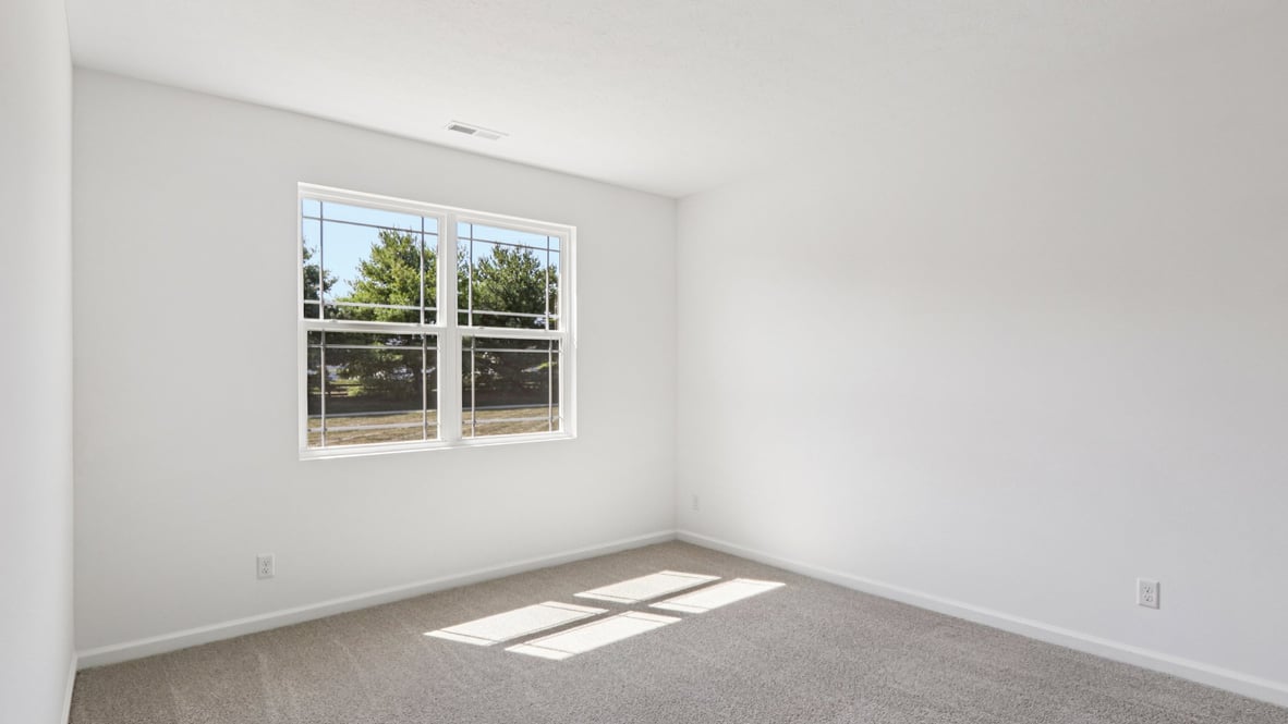 primary bedroom with large windows