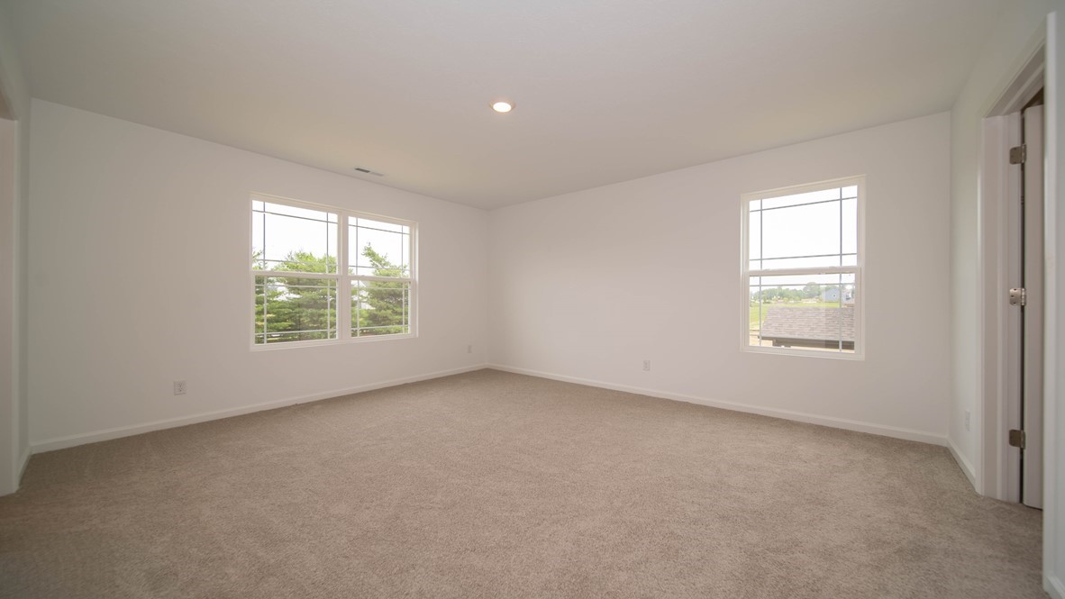 primary bedroom with large windows