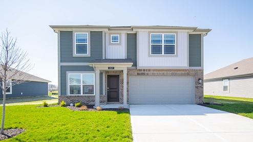 two story home exterior green and gray