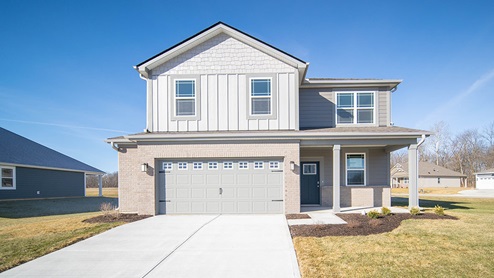 two story home with side garage extension