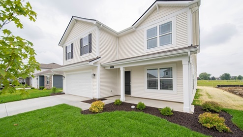 two story home exterior with front porch