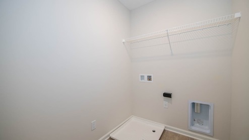 Laundry room located on upper floor of home