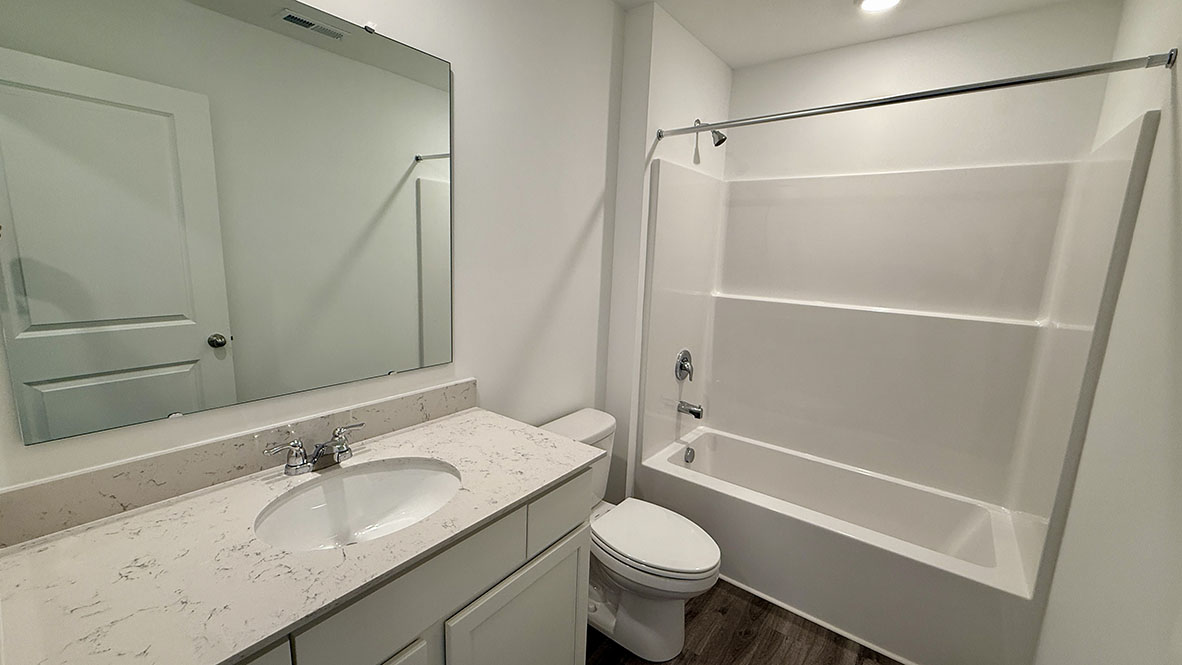 bathroom with shower and tub combo