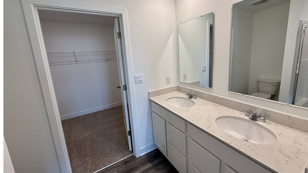 primary bathroom with dual vanity