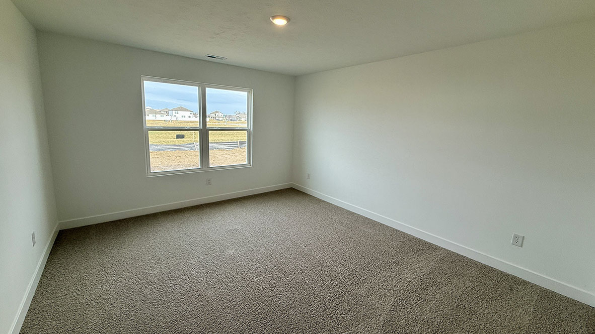 primary bedroom with large windows