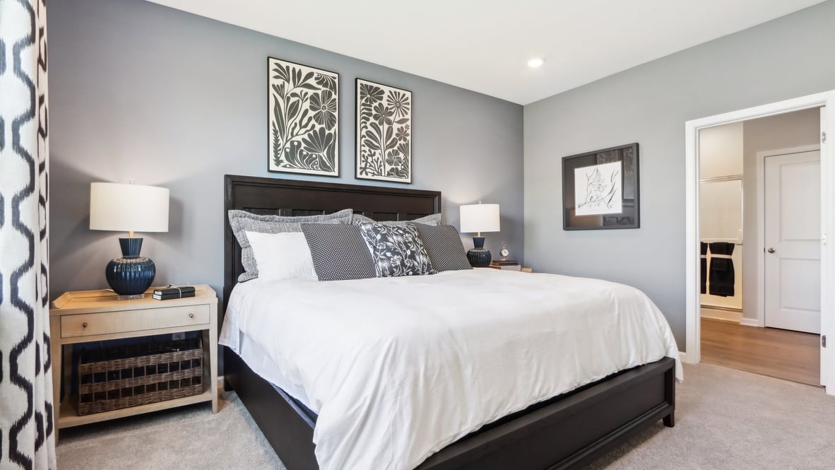 primary bedroom with king size bed and nightstand