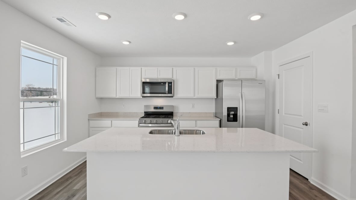 kitchen with window overlooking rear yard