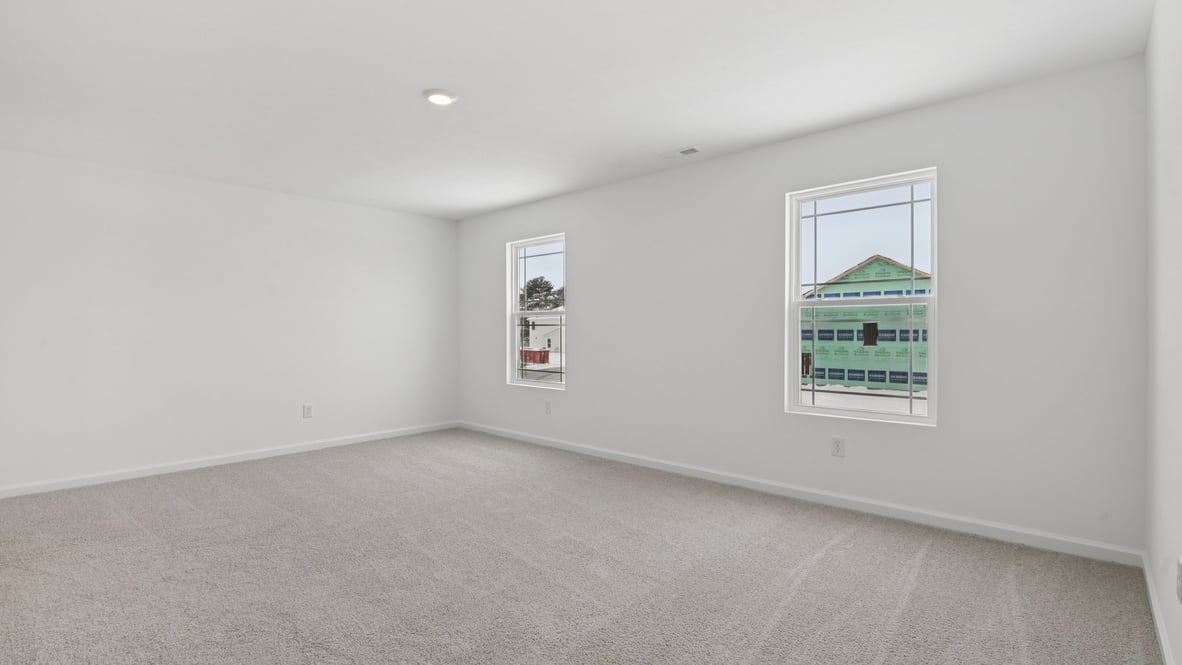primary bedroom with windows