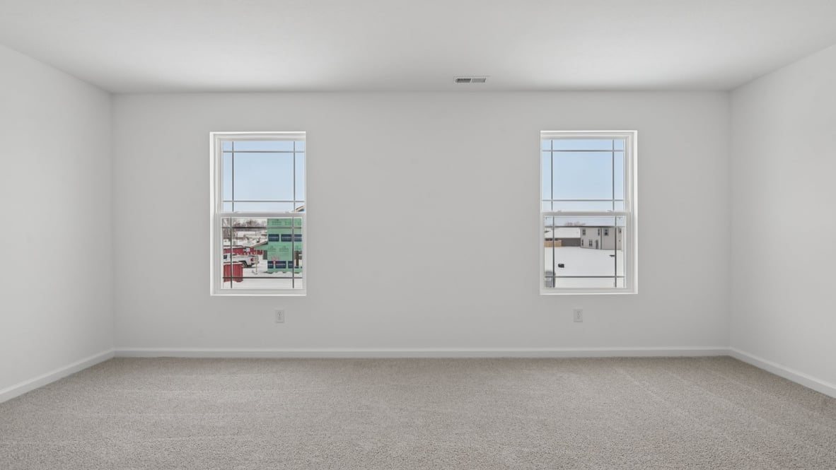 two windows of the primary bedroom