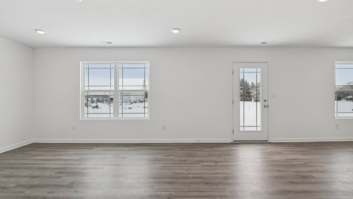 great room with large windows and easy access to the patio door