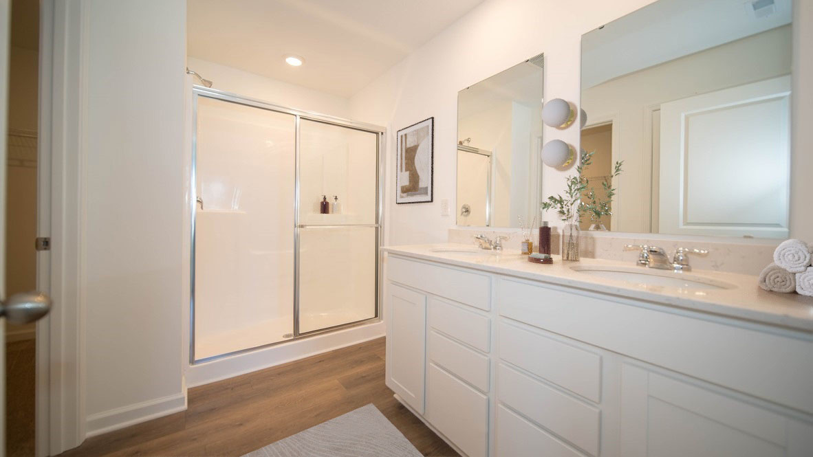 primary bathroom with dual vanity