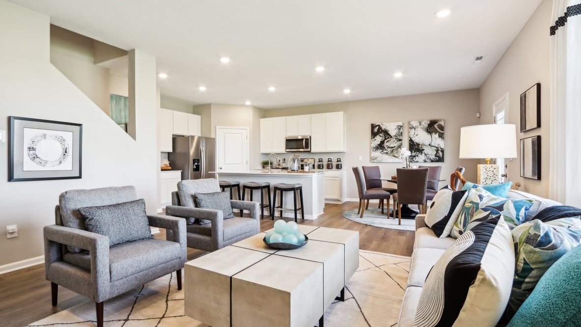 great room with couch and two chairs