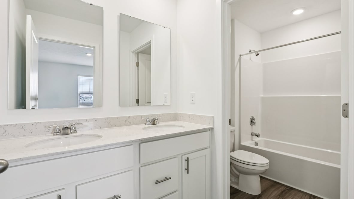 bathroom with dual vanity