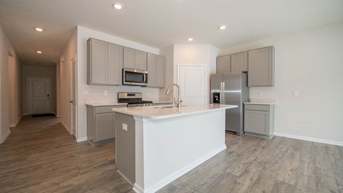 kitchen with gray cabinets and island