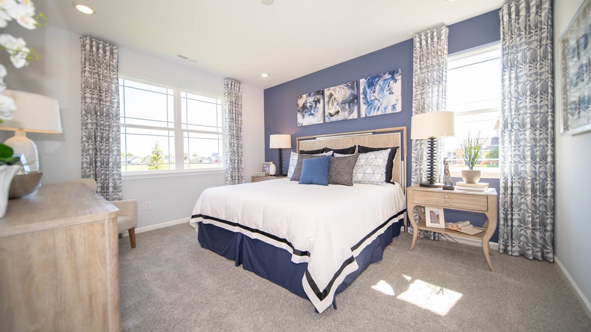 primary bedroom with lots of natural lighting