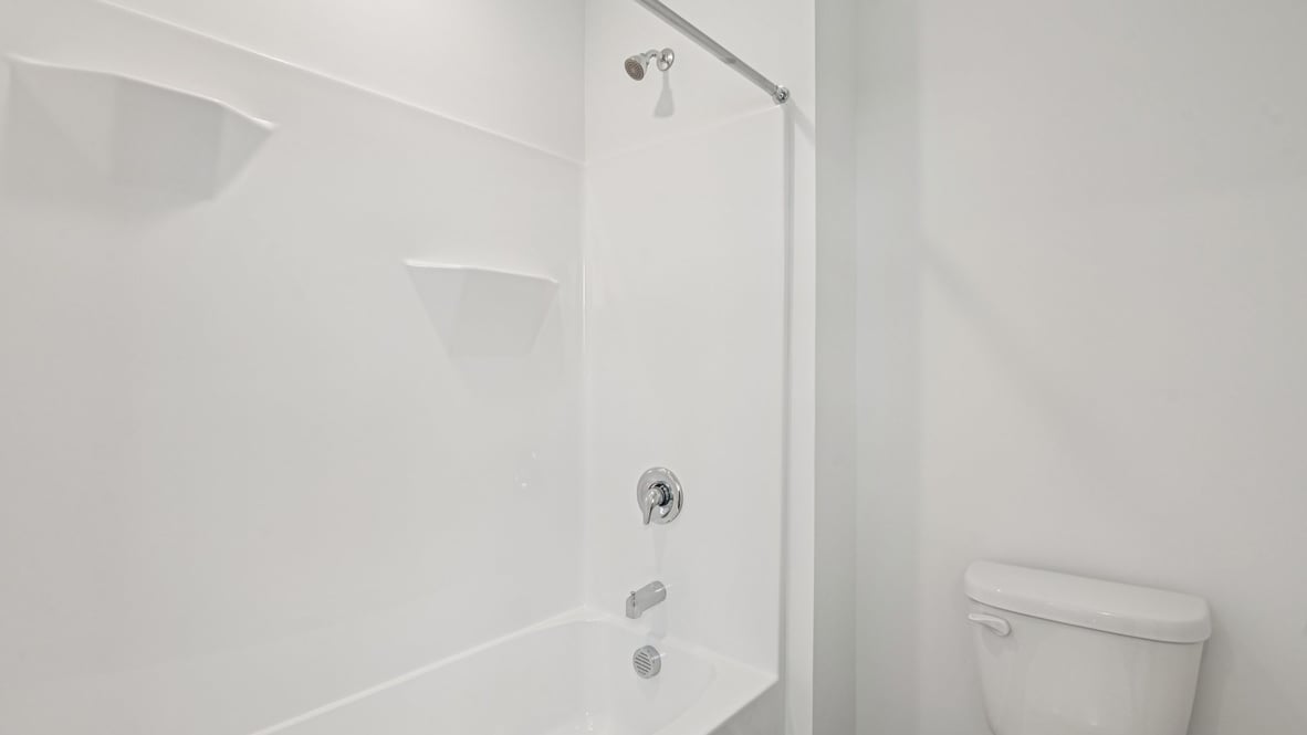 bathroom with shower and tub combo