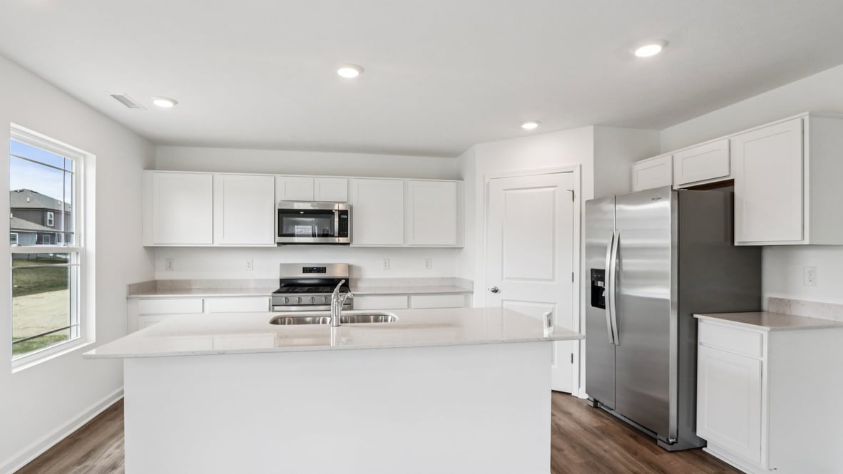 Central kitchen island with sink, seating, crafted to anchor the home, pantry, prep zones, perfect for entertaining and everyday gathering