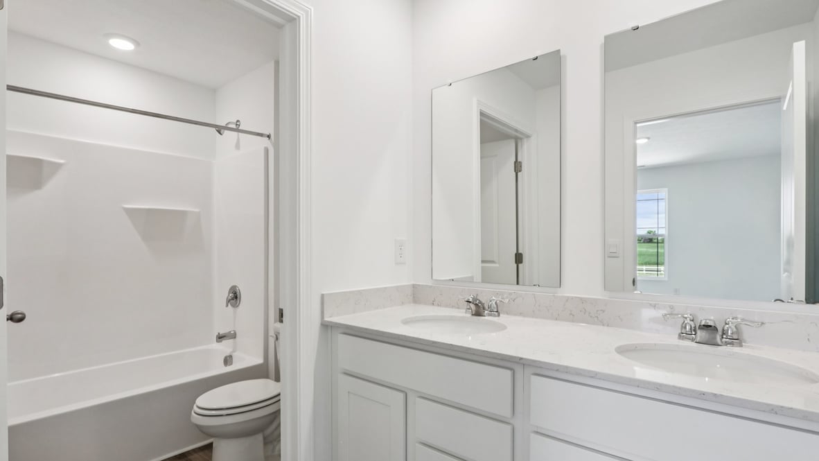 Owner’s ensuite in a new build home offers function and style with a walk-in closet, spa-like ensuite