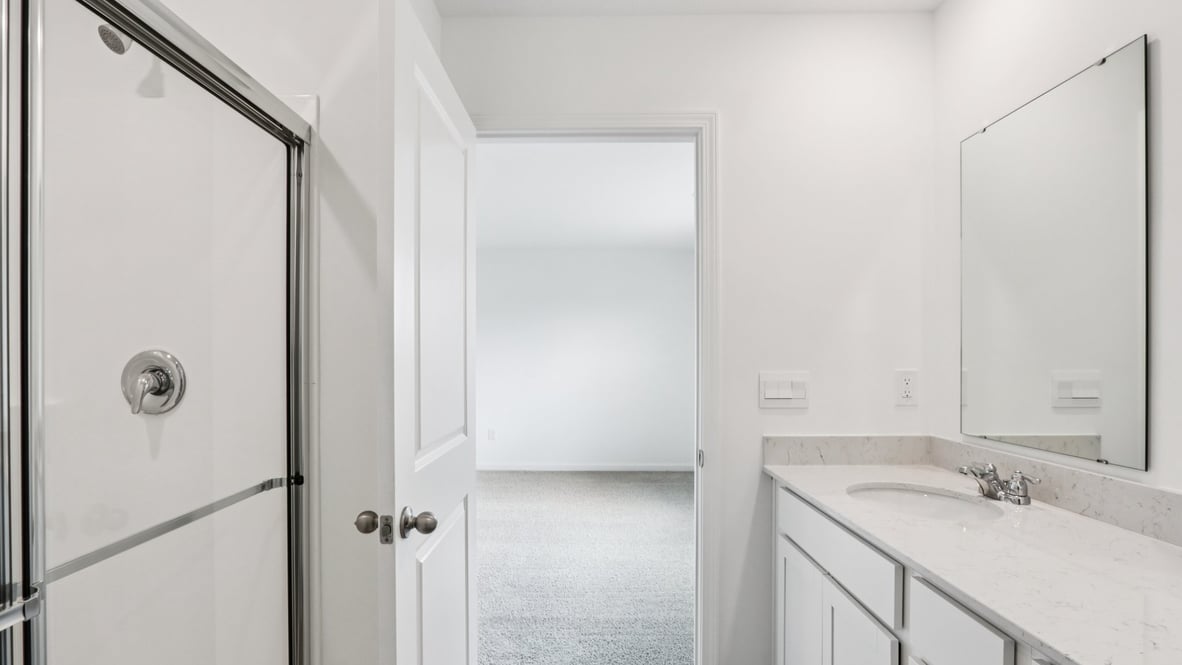 Secondary bath with built-in tub-shower combo, vanity, sink, lighting, stylish finishes in Centre Place