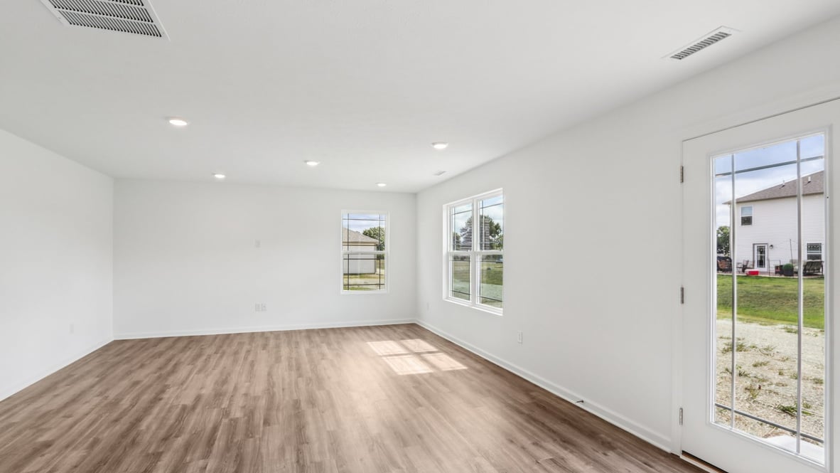 View from kitchen into the dining and living rooms with outdoor access from your patio at Centre Place