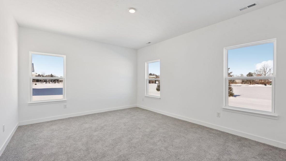 primary bedroom with large windows