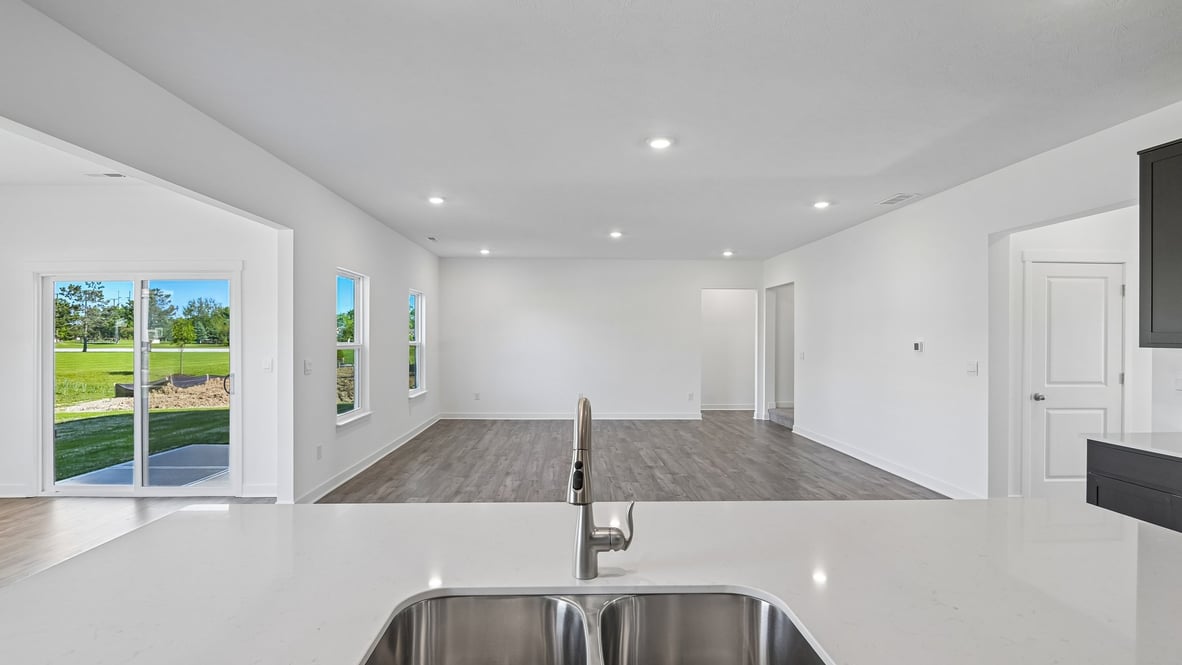open concept living and dining area along with kitchen