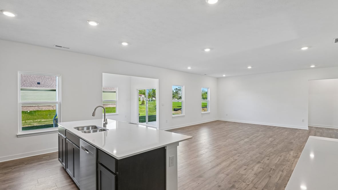 open concept living and dining area along with kitchen