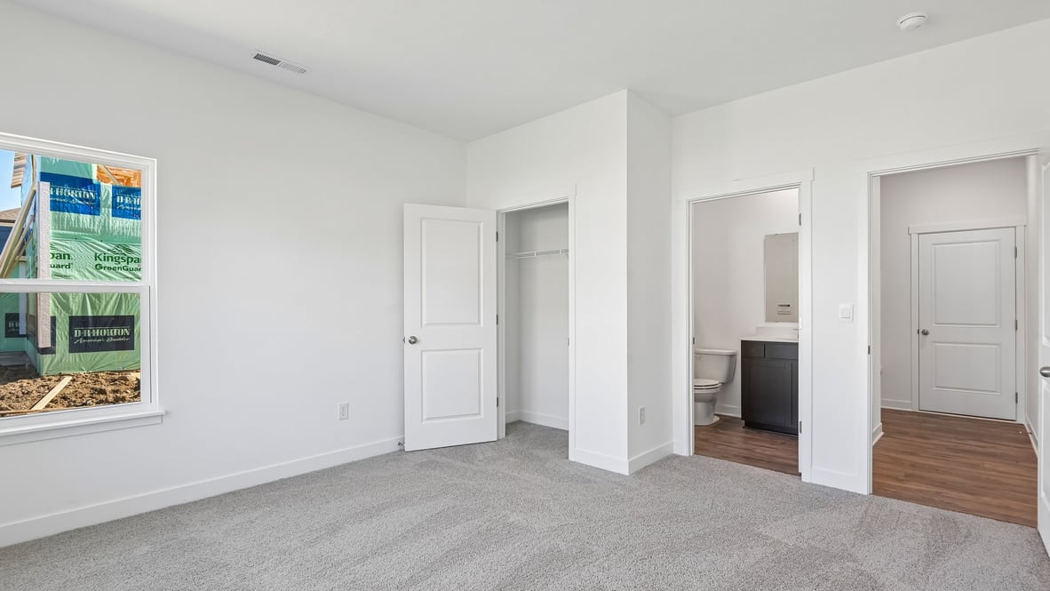 bedroom with attached bath on first floor