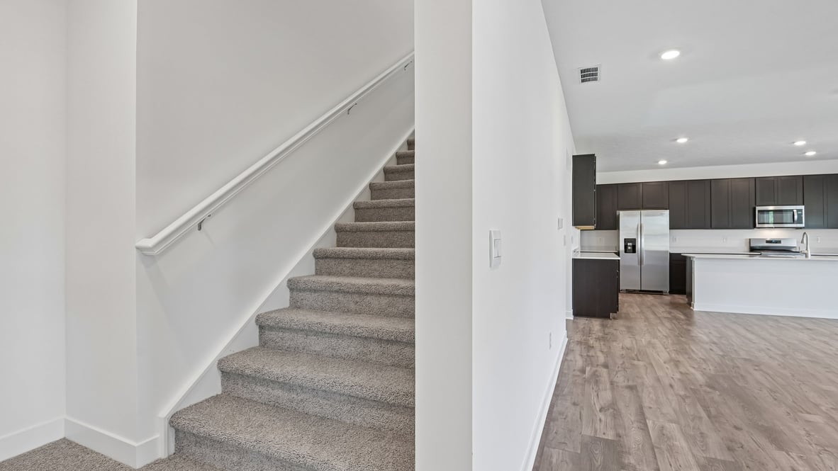 beautiful tucked in staircase with wide area