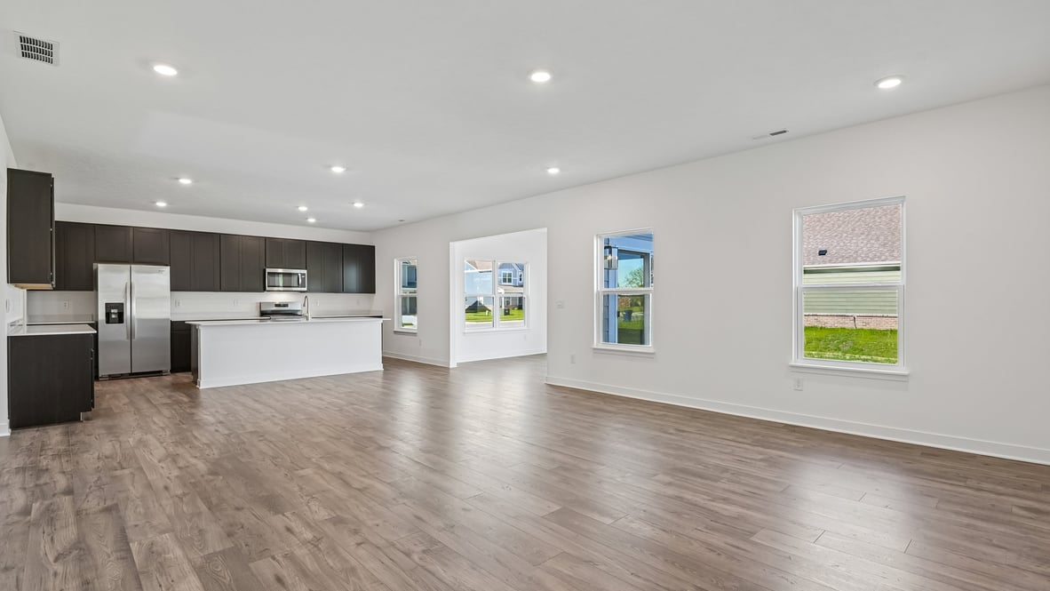 open concept living and dining area along with kitchen