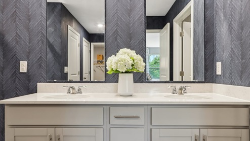 dual sink vanity in primary bathroom