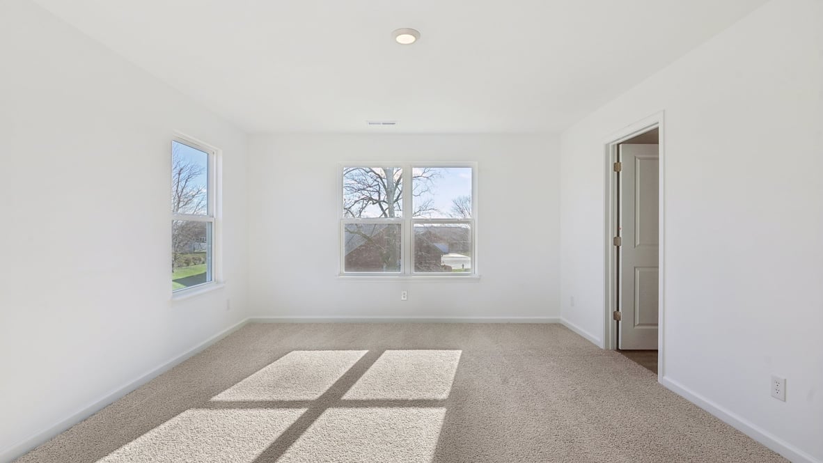 primary bedroom with large windows
