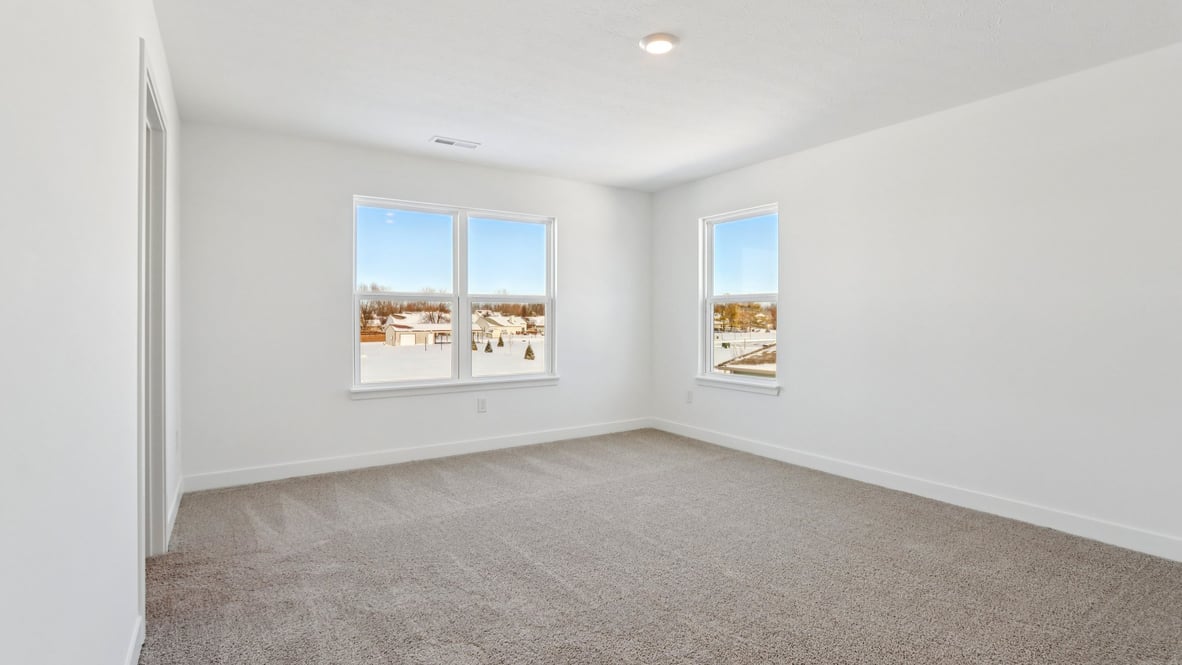 primary bedroom with large windows