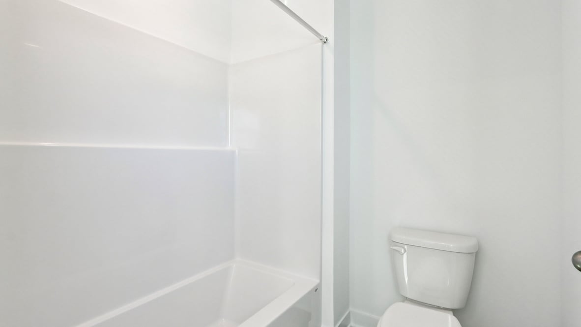 bathroom with shower and tub combo