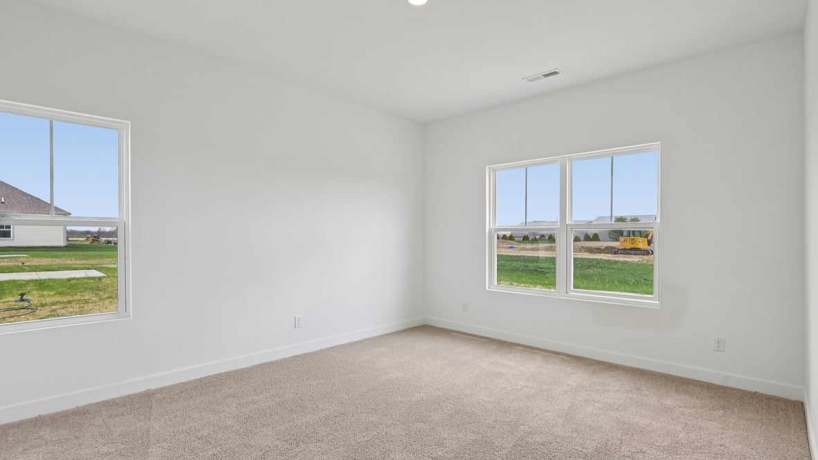 primary bedroom with large windows