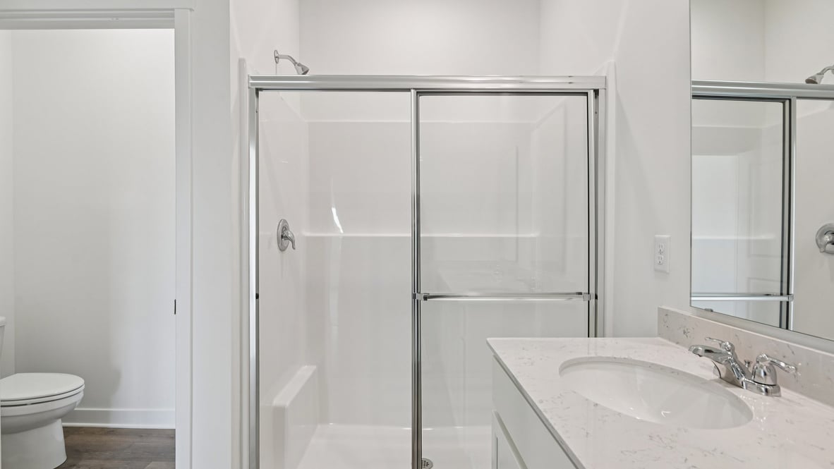 primary bathroom with dual vanity