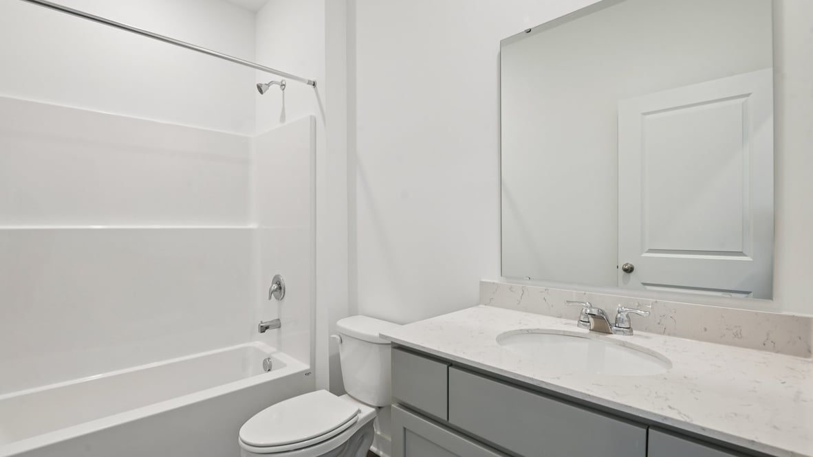 bathroom with shower and tub