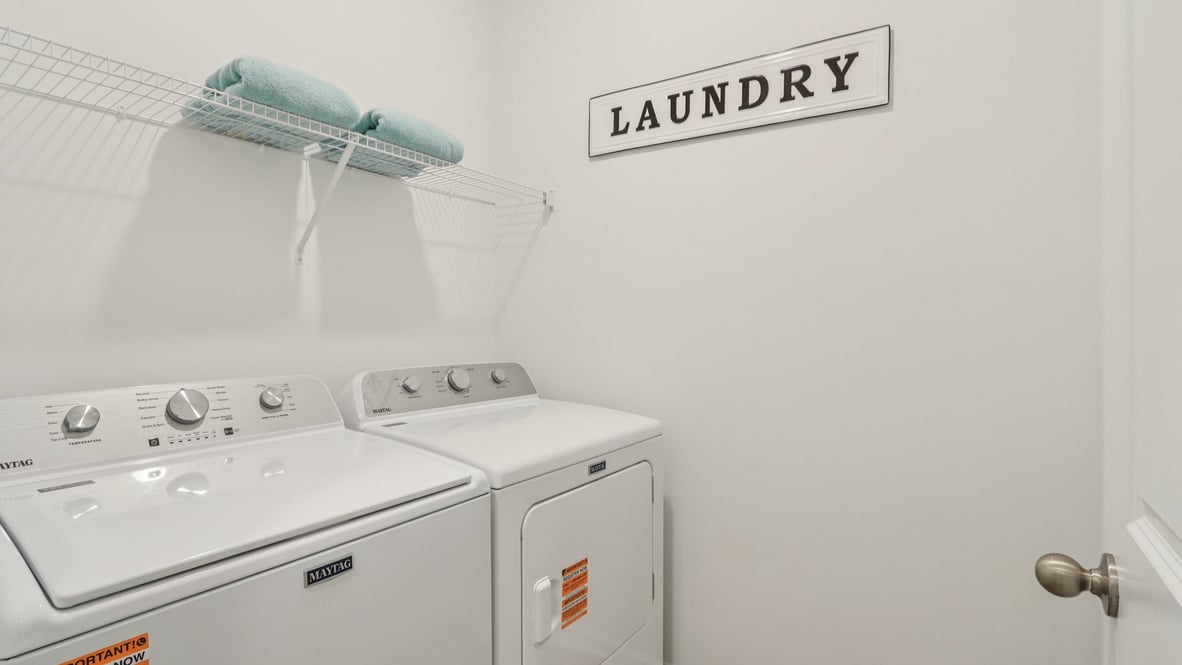 laundry room with washer and dryer and shelving