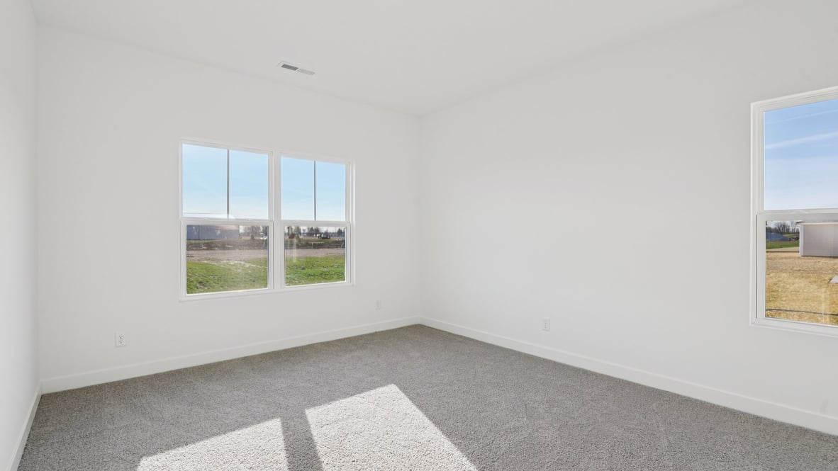 primary bedroom with large windows