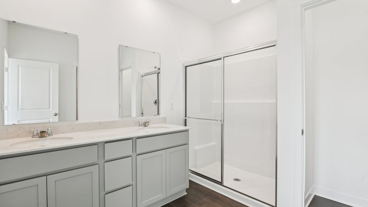 primary bathroom with dual vanity