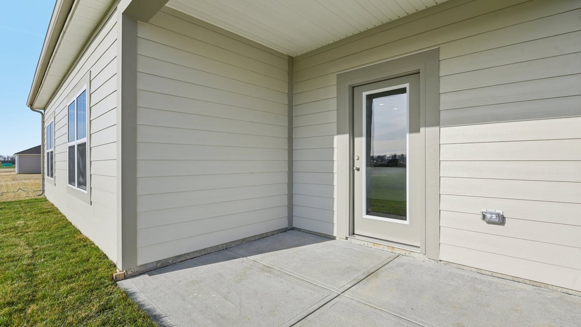 covered patio on the back of the home