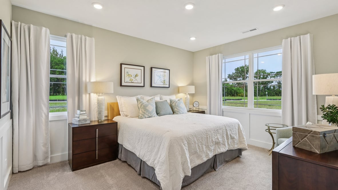 primary bedroom with large windows