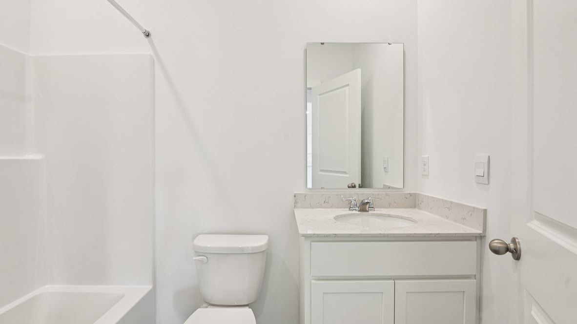bathroom with shower and tub