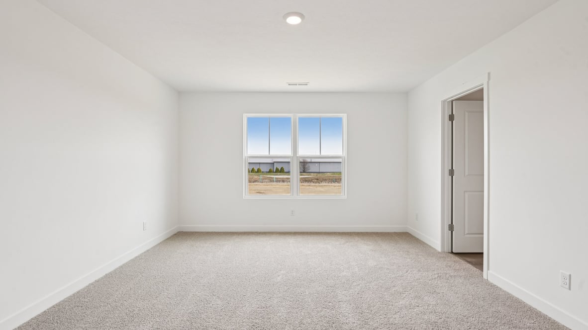 primary bedroom with large windows