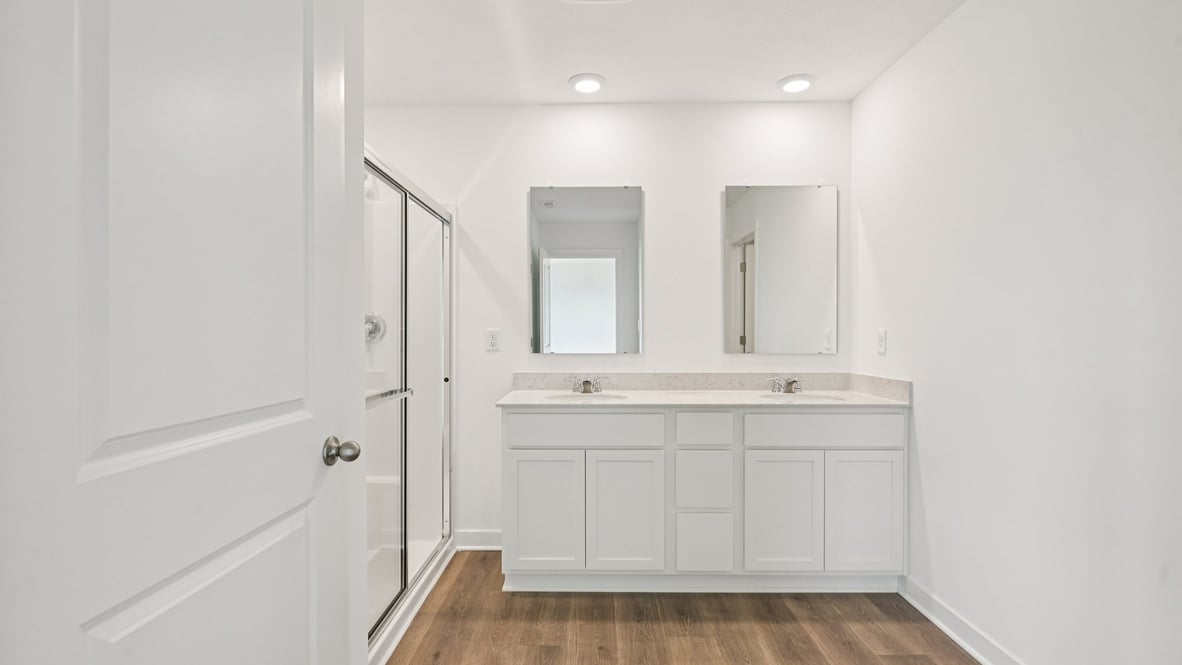primary bathroom with dual vanity