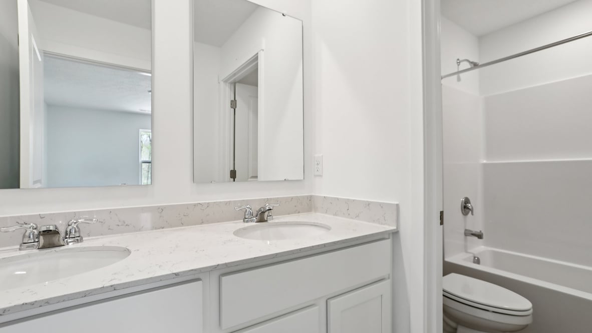 bathroom with dual vanity