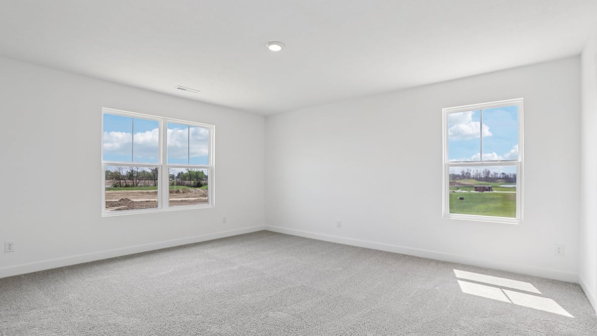 primary bedroom with large windows